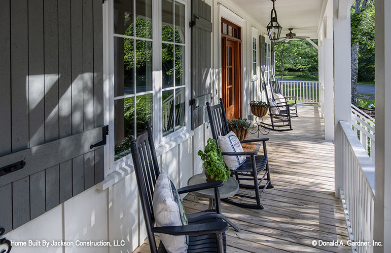 Peaceful rocking chairs on covered front porch. The Glousester plan 1188. 