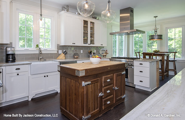 Farmhouse sink and double windows above the sink in the kitchen. The Glousester plan 1188. 