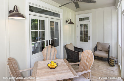 Seating area and outdoor ceiling fan in the screened in porch. The Glousester plan 1188. 