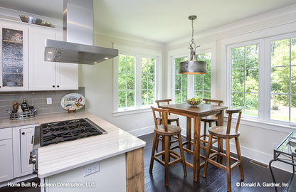 Breakfast nook off to the side of the kitchen surrounded by windows. The Glousester plan 1188. 