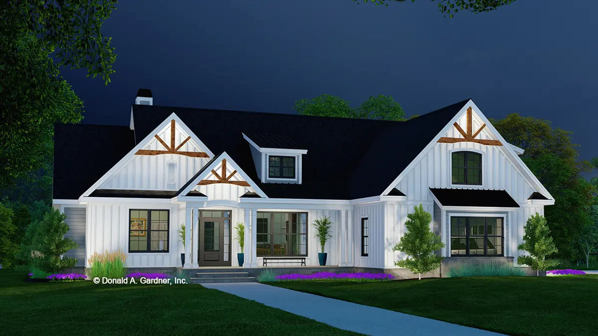 This is an illustration of the front of one story house plan 1571 The Grindelwald at dusk