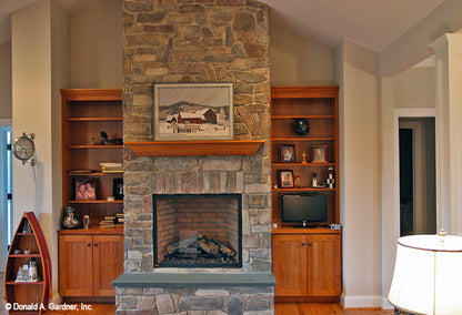 Floor to ceiling stone fireplace. The Hammond Hill plan 1217.