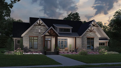 This is an illustration of the front of ranch house plan 1652 The Harrington at dusk