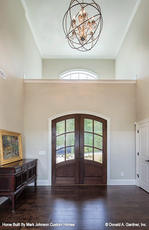 Arch french doors in the foyer. The Hartwell plan 1221.