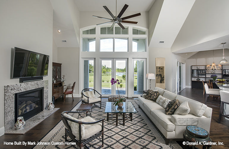 Arched windows with french doors leading to patio from the great room. The Hartwell plan 1221.