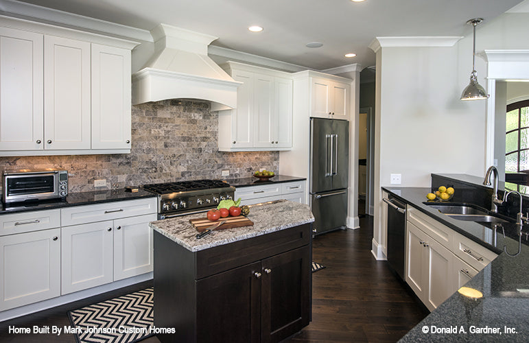 Lots of counter space and island in the kitchen. The Hartwell plan 1221.