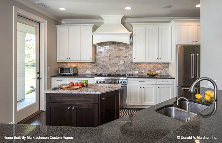 Single door in the kitchen leading to the rear porch. The Hartwell plan 1221.