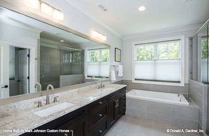 Double sink vanity with sitting tub off to the side in the master bathroom. The Hartwell plan 1221. 