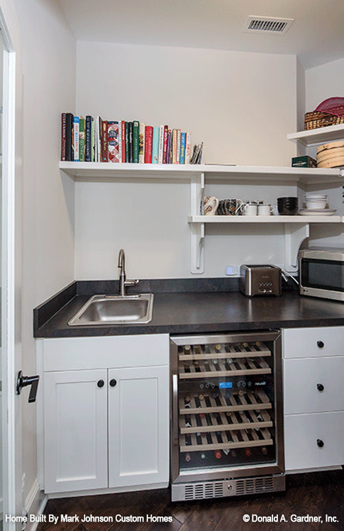 Mini sink and fridge at the wet bar. The Hartwell plan 1221.