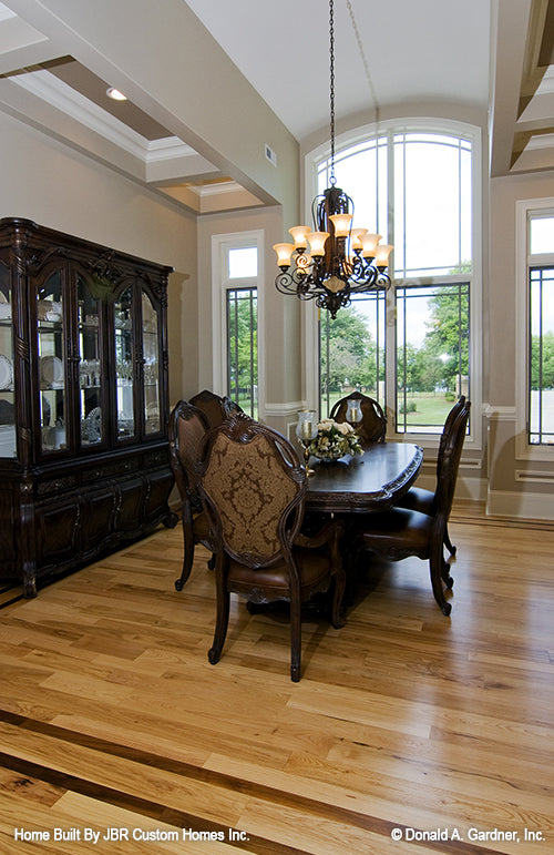 Floor to ceiling arched windows in the dining room. The Heatherstone plan 5016. 