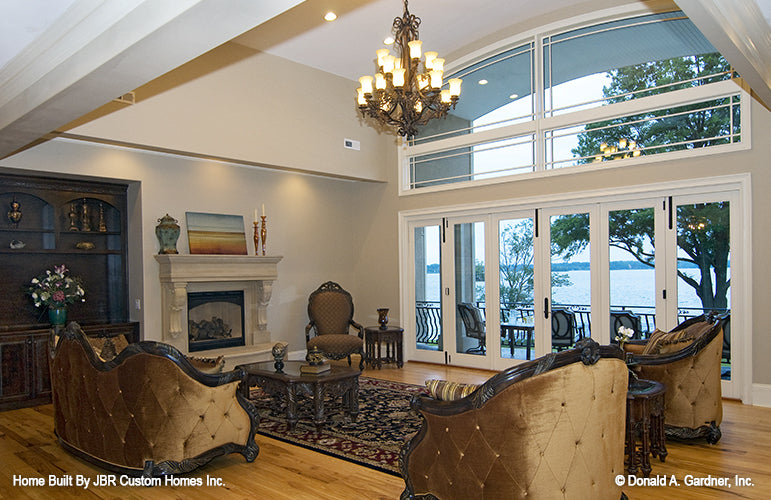 Fireplace and chandelier in the great room. The Heatherstone plan 5016. 