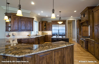 Wood stained cabinets in the kitchen. The Heatherstone plan 5016. 