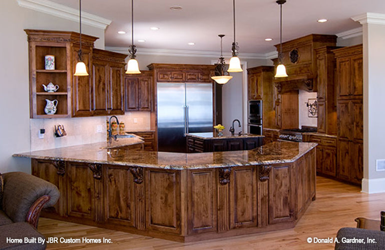 Curved counter height bar in the kitchen. The Heatherstone plan 5016. 