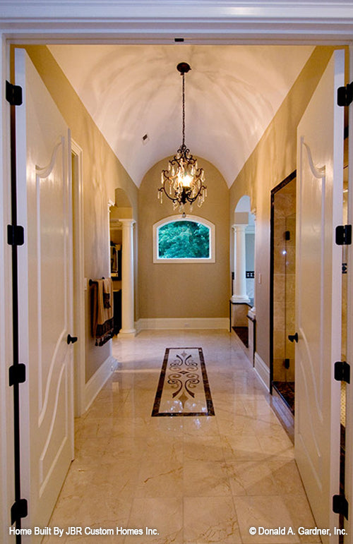 Curved ceiling and chandelier in the bathroom. The Heatherstone plan 5016. 