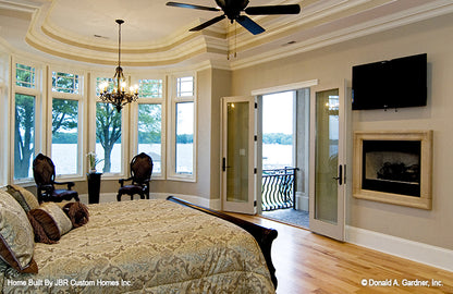 Tray ceiling and french doors to the patio in the master bedroom. The Heatherstone plan 5016. 