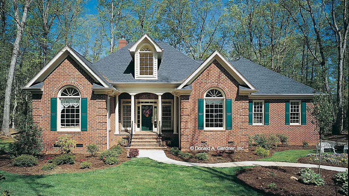 This is a photograph of the front of four bedroom house plan 302 The Herndon as built by a customer