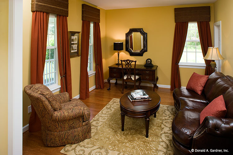 Flat ceiling and wood floors in the study. The Heywood plan 991.