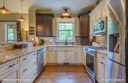 Large kitchen with functional space for High-Pointe house plan 713