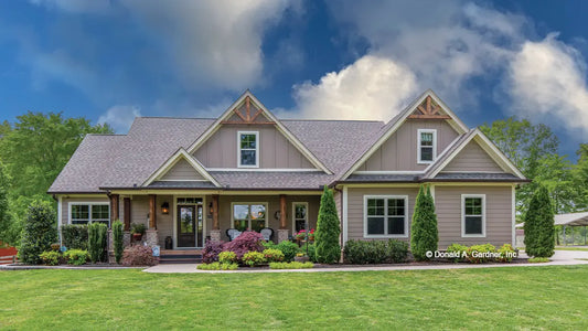 This is a photograph of the front of traditional house plan 713 The High Pointe as built by a customer