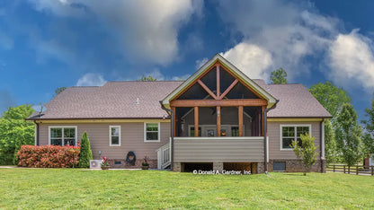 This is a photograph of the rear of ranch house plan 713 The High Pointe as built by a customer