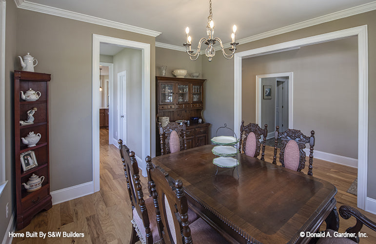 Crown molding around the ceiling and doorways in the dining room. The Hinnman plan 1242. 