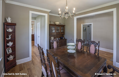 Crown molding around the ceiling and doorways in the dining room. The Hinnman plan 1242. 