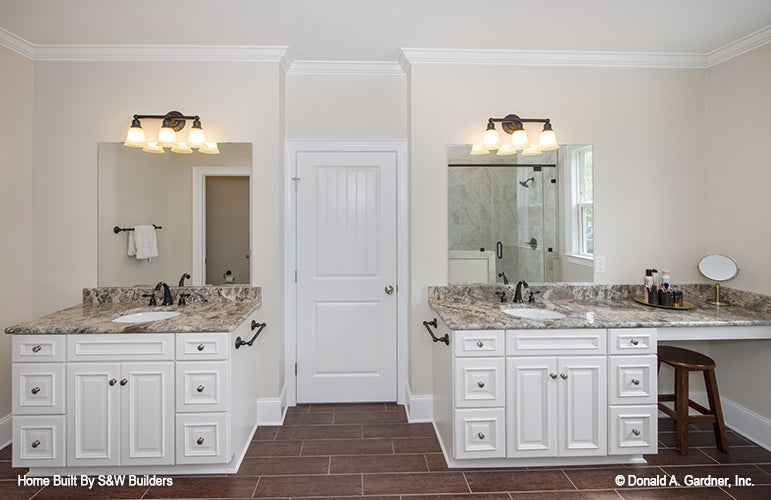 Separate vanities in the master bathroom. The Hinnman plan 1242. 