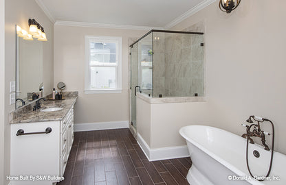 Sitting tub and walk-in shower in the master bathroom. The Hinnman plan 1242. 