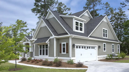 Side garage view photograph submitted by the customer. The Hinnman plan 1242. 