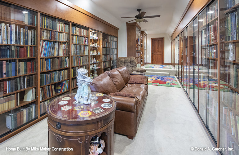 Wall to wall bookshelves in the bonus room. The Holden plan 1168.