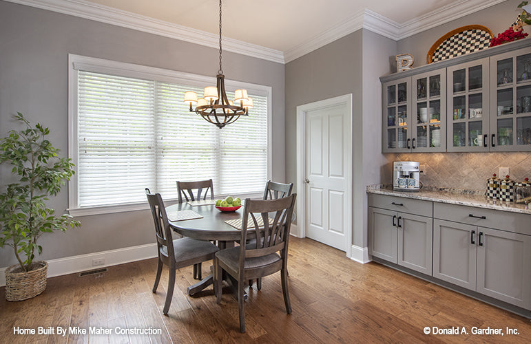 Triple window and crown molding in the breakfast nook. The Holden plan 1168.