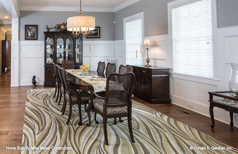 Well-lit dining room with two large windows. The Holden plan 1168.