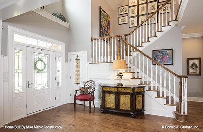 Foyer staircase leading up to second level. The Holden plan 1168.