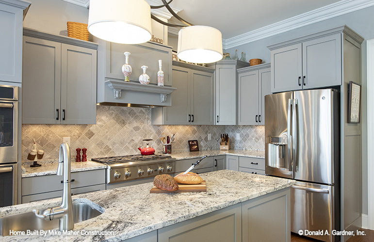 Stainless-steel appliances in the kitchen. The Holden plan 1168.