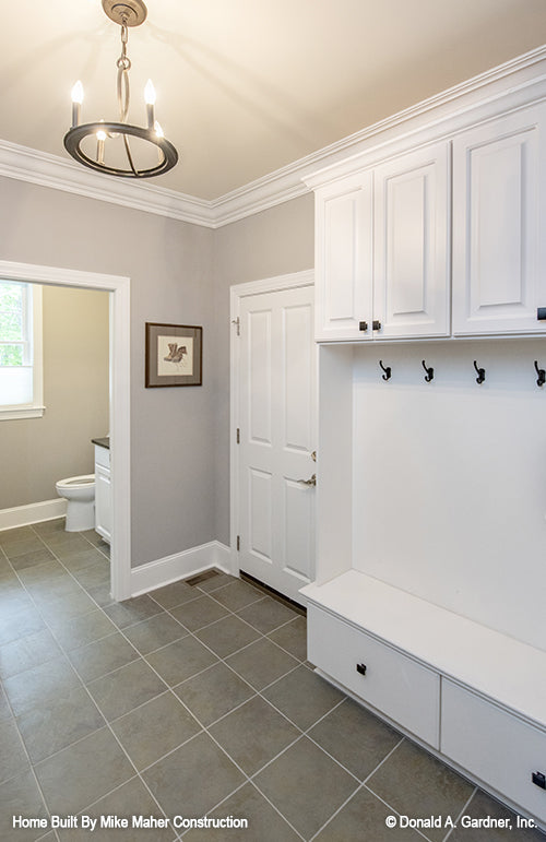 Wall tree and bathroom in the mud room. The Holden plan 1168.