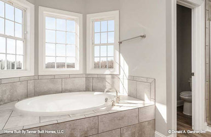 This is a picture of the tub and master bathroom of farmhouse house plan 1140 The Hollandale