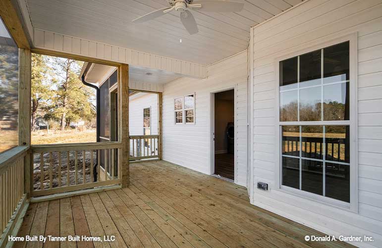 This is a picture of the screened porch of farmhouse house plan 1140 The Hollandale