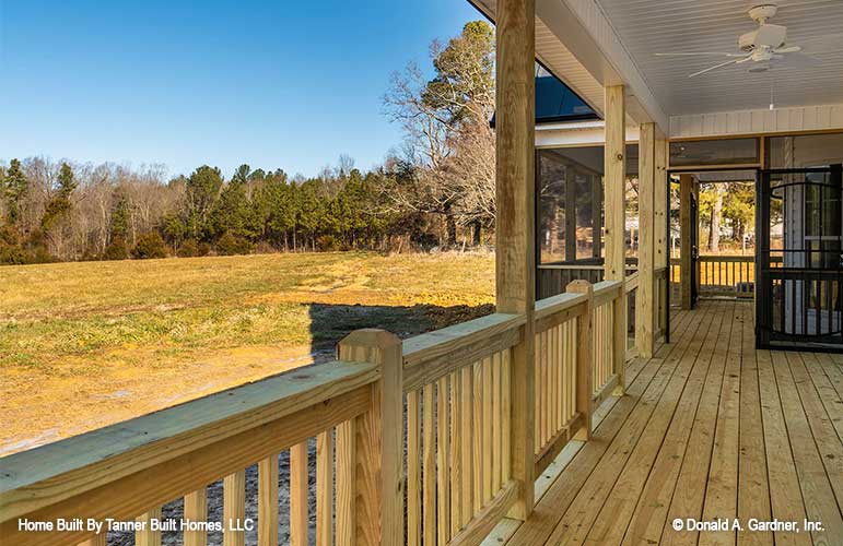 This is a picture of the rear porch of farmhouse house plan 1140 The Hollandale