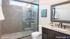 Walk-in shower with small window in the bathroom. The Hollowcrest plan 5019.