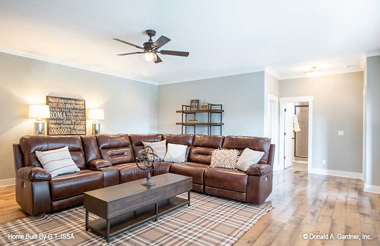 Ceiling fan and flat ceiling in the entertainment room. The Hollowcrest plan 5019.