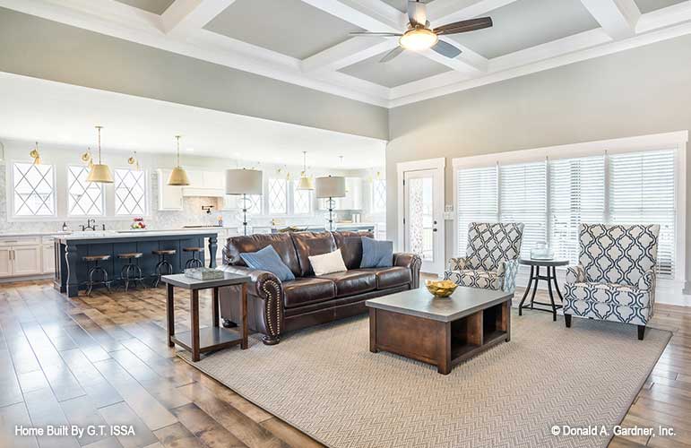 Great room view into the kitchen island seating. The Hollowcrest plan 5019.