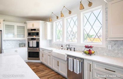 Three large windows above the kitchen sink. The Hollowcrest plan 5019.