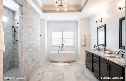 Walk-in shower and double sink vanity in the master bathroom.