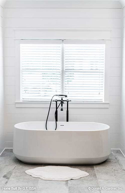 Stand-alone bathtub in the master bathroom. The Hollowcrest plan 5019.