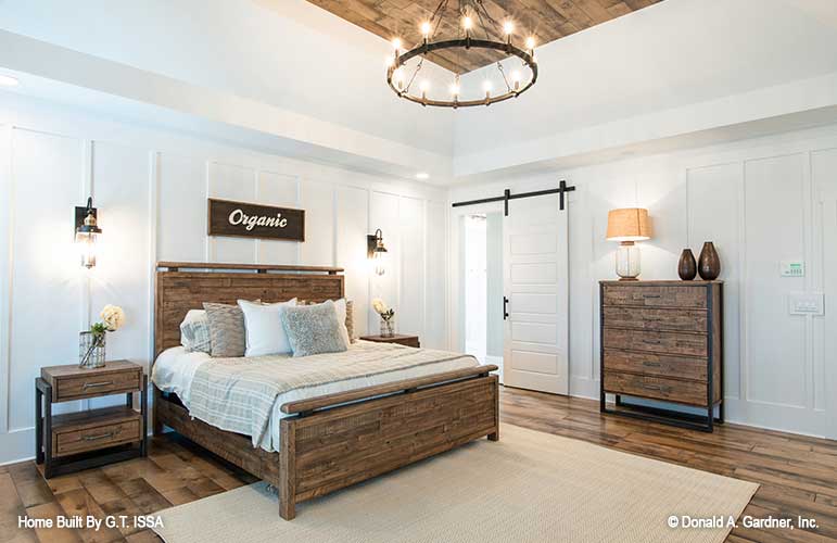 Sliding barn style door in the master bedroom. The Hollowcrest plan 5019.