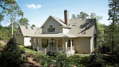 This is a photograph of the rear of farmhouse plan 864 The Hollyhock as built by a customer