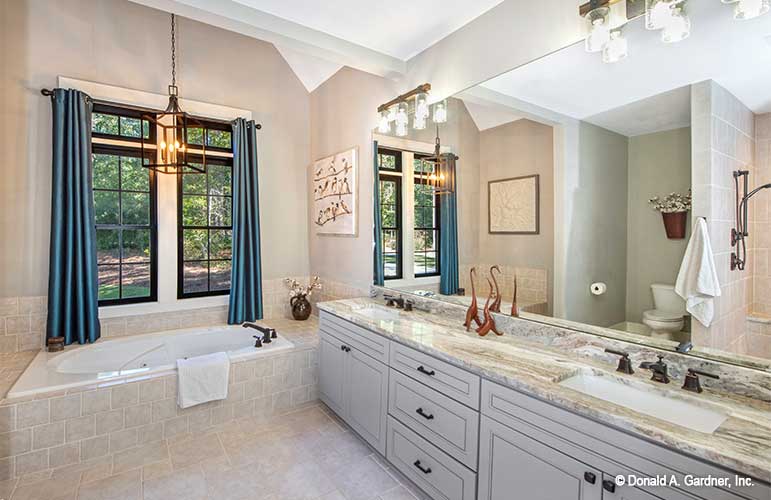 Double sink vanity next to the soaking tub in the master bathroom. The Hunter Creek plan 1326.