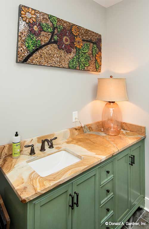 Single sink and green cabinets in the utility room. The Hunter Creek plan 1326.