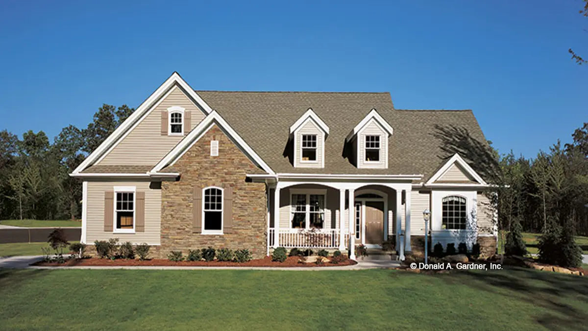 This is a photograph of the front of small house plan 831 The Idlewild as built by a customer