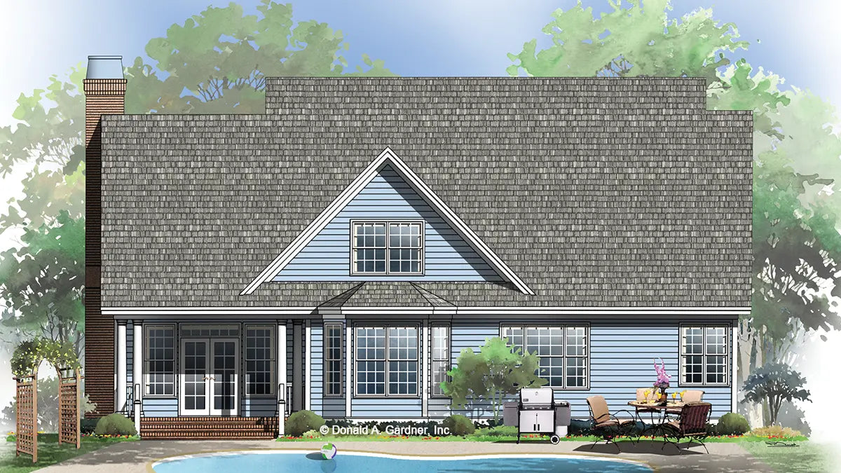 traditional home from the rear showing the covered porch and bay window in the dining room